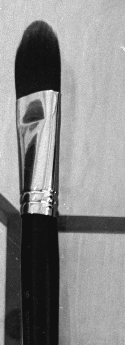 A black paintbrush, up close