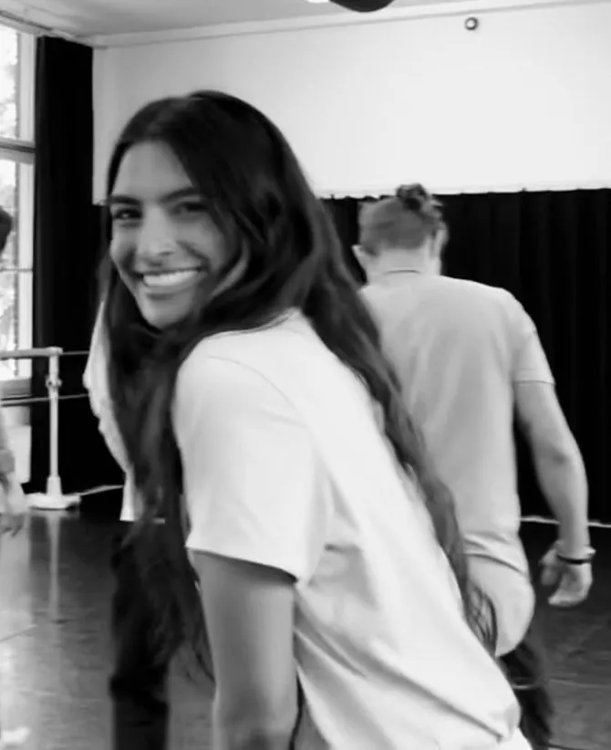 Reena smiling at the camera during a session