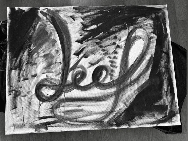 An abstract painting with the word feel, which reads leef (live) the other way round